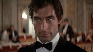 The new younger James Bond is wearing a tuxedo in a restaurant. He's looking pretty damn hot.